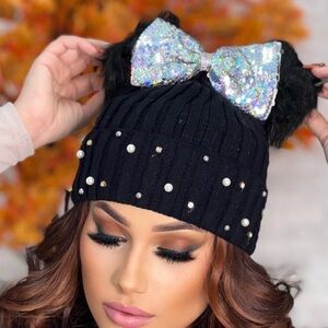Beautiful Angelix Beanie with Sequin Bow and double Pom poms.  New in package.